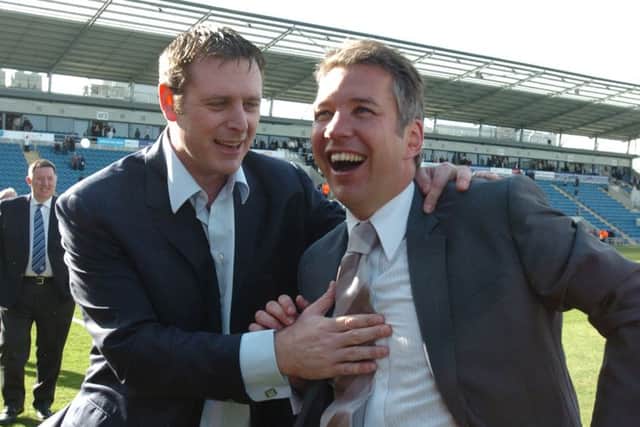 Chairman Darragh MacAnthony (left) and manager Darren Ferguson celebrate a Posh promotion.