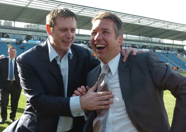 Chairman Darragh MacAnthony (left) and manager Darren Ferguson celebrate a Posh promotion.