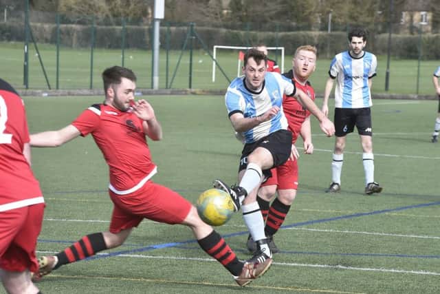 Action from a thrilling cup semi-final between Premiair Reserves (stripes) and Orton Rangers. Photo: David Lowndes.