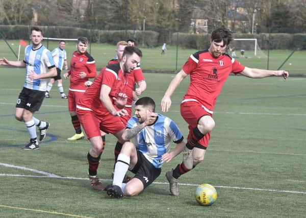 Action from the Peterborough Minor Cup semi-final between Premiair Reserves (stripes) and Orton Rangers. Photo: David Lowndes.
