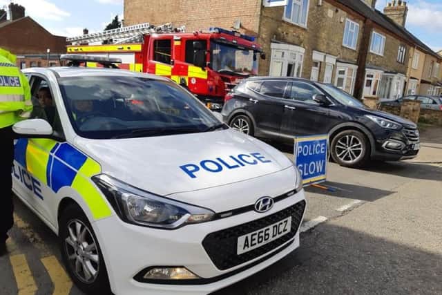 Police at the scene of one of the raids which took place in Padholme Road, Alma Road, Westmoreland Gardens and Sheepwalk in Paston.