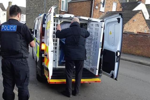 One of four arrests being made during the raids