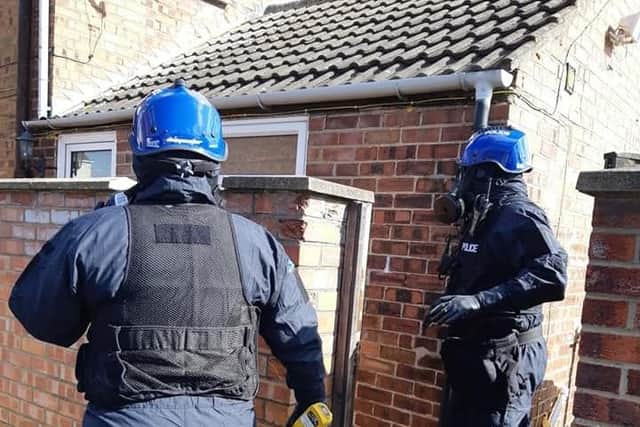 Chemical Bioglogical Radiological and Nuclear (CBRN) officers about to enter a Peterborough property.