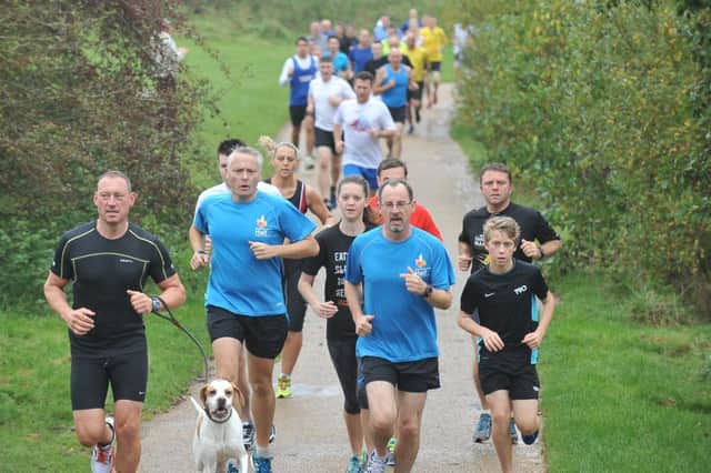 Runners Taking part in the Peterborough Park Run at Ferry Meadows EMN-141018-170556009