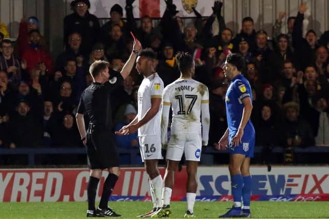 Rhys Bennett is sent off by referee Ollie Yates. Photo: Joe Dent/theposh.com