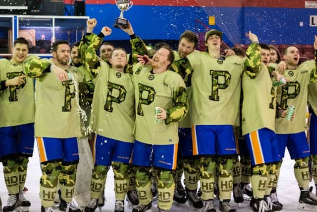 Phantoms players celebrate with the trophy. Picture: Tom Scott