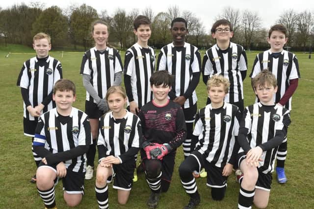 Oundle Under 12s are pictured before their 3-0 defeat by Bretton North End. From the left are, back, Etienne Le Hair, Ruby Deegan, Luke Durman, Jordan Chimane, Liam Semenchuk, Lawson Estop, front, Liam Caruana, Emily Huffines, Logan Draper, Willis Bentley and James Silcock.