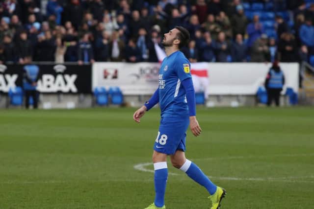 Daniel Lafferty of Peterborough United leaves the pitch dejected at full-time after Coventry's 2-1 win at the ABAX Stadium. Photo: Joe Dent/theposh.com.