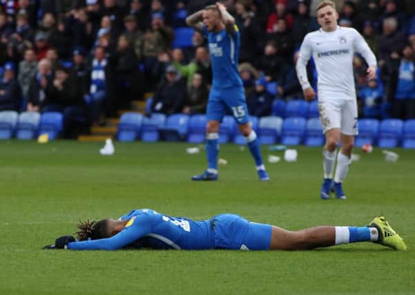 Posh striker Ivan Toney is flat out after falling over when clean through on the Coventry goal. Photo: Joe Dent/theposh.com.