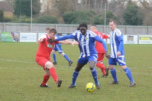 Ali Nyang (blue) in action.