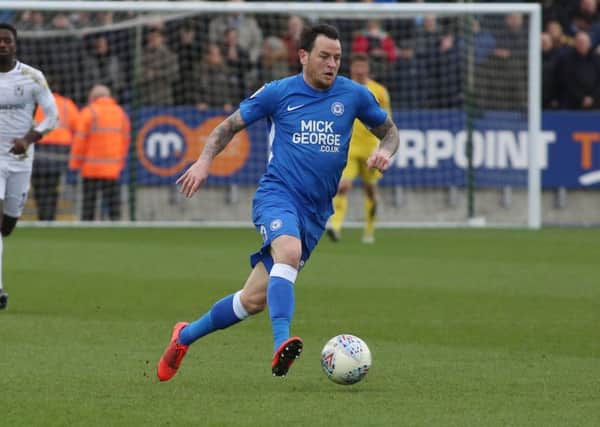 Lee Tomlin in action for Posh.