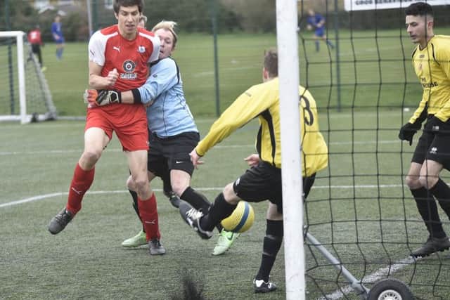 Action from a Peterborough League Division Two game between Netherton Reserves (yellow) and Spalding Athletic which the former won 2-0. Photo: David Lowndes.