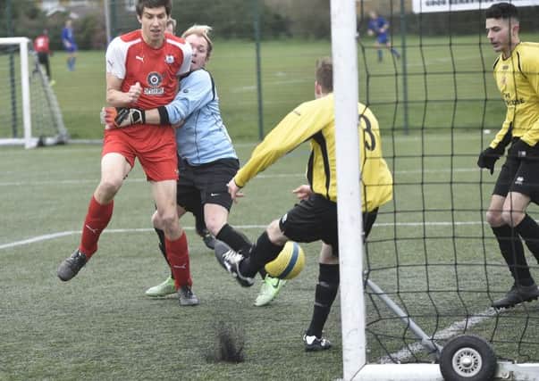 Action from a Peterborough League Division Two game between Netherton Reserves (yellow) and Spalding Athletic which the former won 2-0. Photo: David Lowndes.