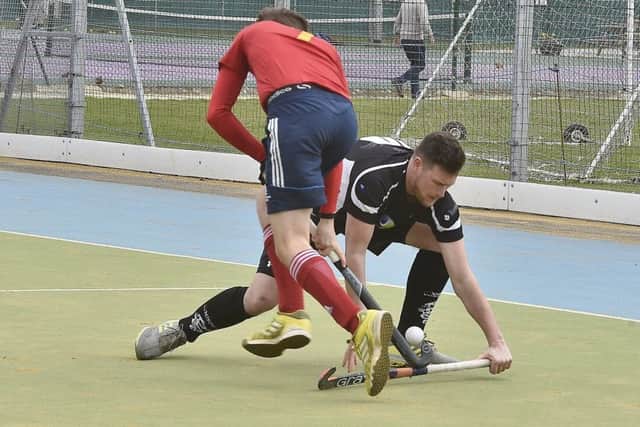Action from City of Peterborough seconds (red) win over Bourne Deeping firsts. Photo: David Lowndes.