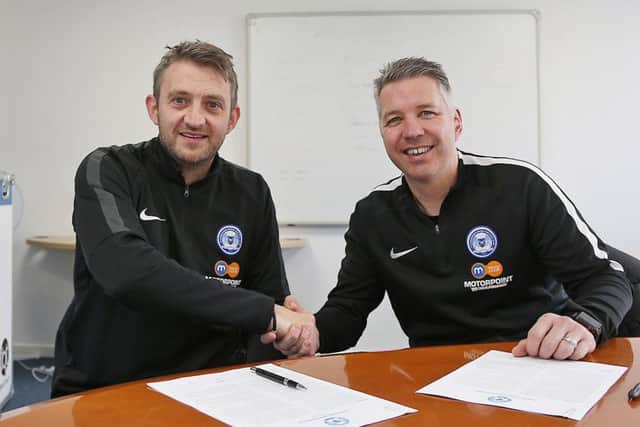 Darren Ferguson (right) and Gavin Strachan shake hands after signing their new Posh contracts. Photo: Joe Dent/theposh.com.