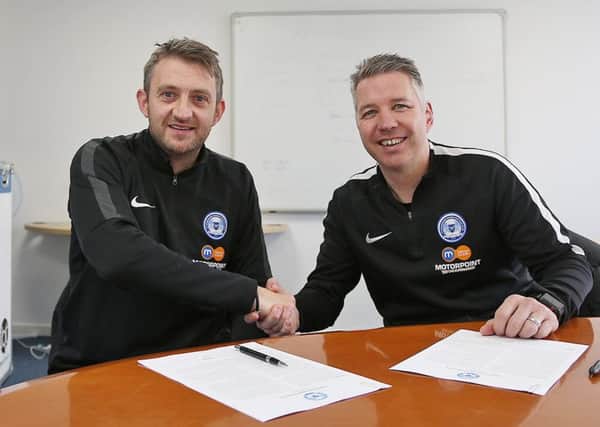 Darren Ferguson (right) and Gavin Strachan shake hands after signing their new Posh contracts. Photo: Joe Dent/theposh.com.