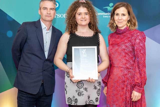 Beatrice with her award, pictured with judge Peter Sutcliffe and Sally Phillips