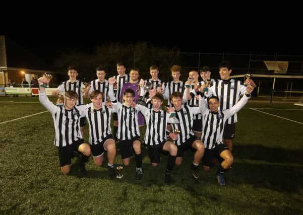 Oundle Town celebrate their victory in the Peterborough & District Youth League Cup FInal. Photo: RWT Photography.