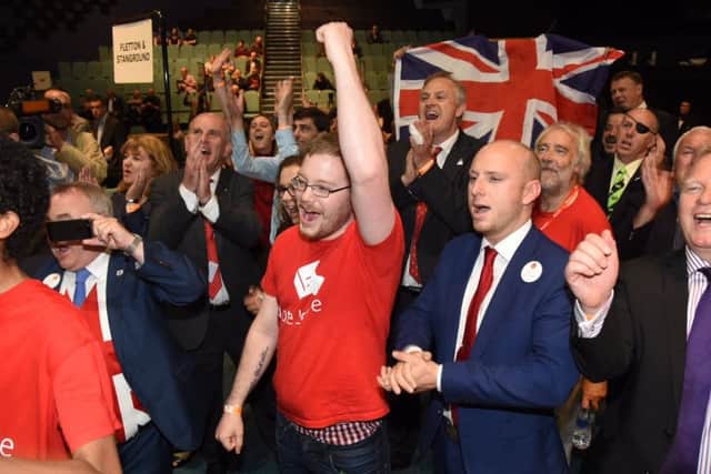 Brexiteers in Peterborough celebrate the news the city voted to Leave the EU