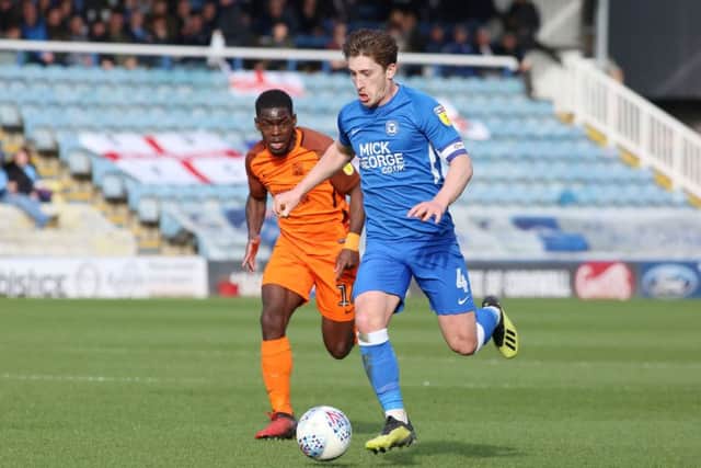 Alex Woodyard of Peterborough United in action with Dru Yearwood of Southend United. Picture: Joe Dent