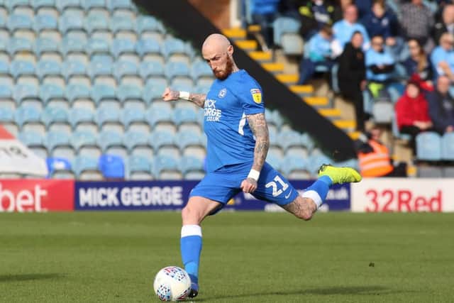 Marcus Maddison of Peterborough United scores the opening goal direct from a free-kick. Photo: Joe Dent/theposh.com.