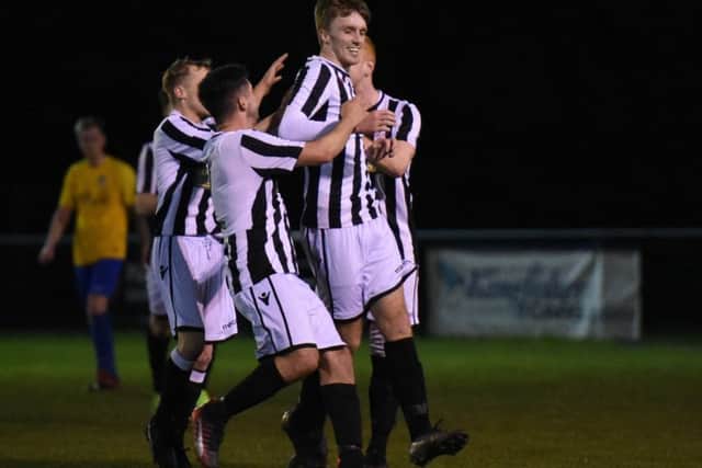 Tom Mann celebrates his goal with Peterborough Northern Star teammates. Photo: Chantelle McDonald. @cmcdphotos.
