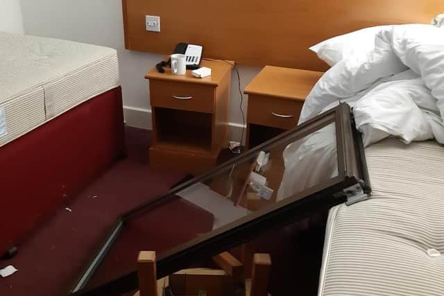 The damage caused to the hotel room where the attack took place