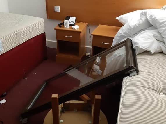 The damage caused to the hotel room where the attack took place