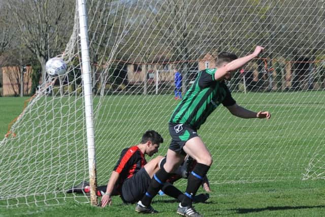 Action from DSV's Hereward Cup semi-final win over Music Solutions (red). Photo: David Lowndes.
