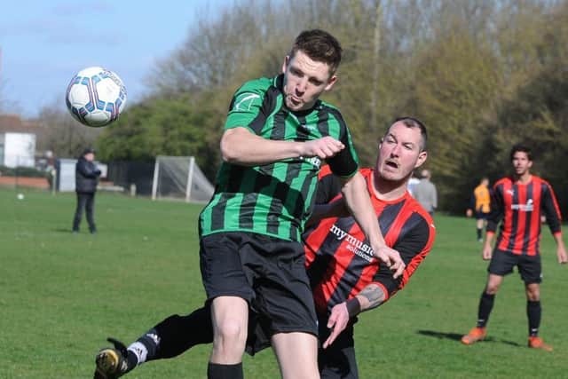 Action from DSV's Hereward Cup semi-final win over Music Solutions (red). Photo: David Lowndes.