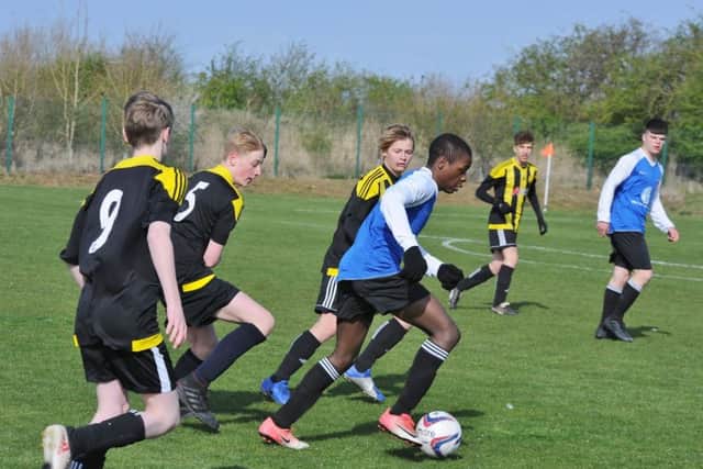 Action from the game between Whittlesey Blue Under 15s and  Crowland.