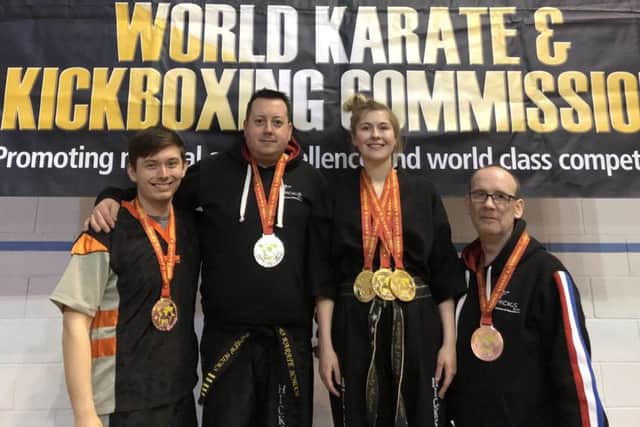 Senior fighters from the Hicks Karate School who were medallists at the WKKC National Championships. From the left are Aaron Dickerson, Sensei Andrew Hicks, Atlanta Hickman and David Prior.