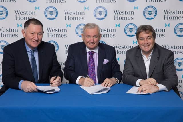 Posh chief executive Bob Symns, Weston Homes chief executive Bob Weston and Posh co-owner Stewart Thompson sign the sponsorship deal