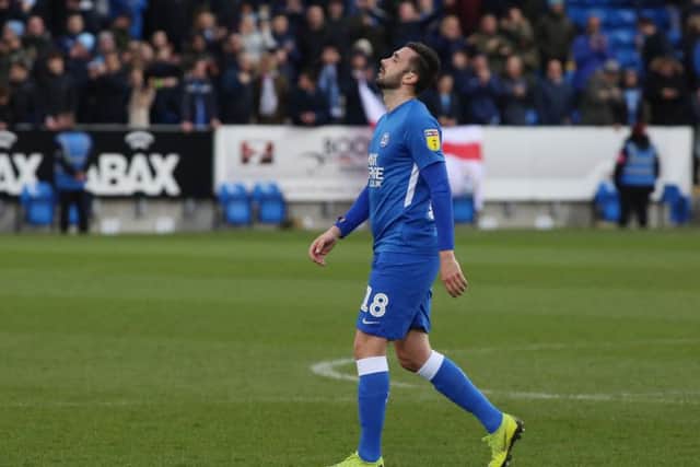Daniel Lafferty is dejected after Posh were beaten at home by Coventry last month.