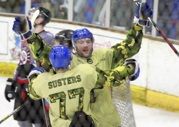 Peterborough Phantoms players celebrate another super Sunday success at Planet Ice.