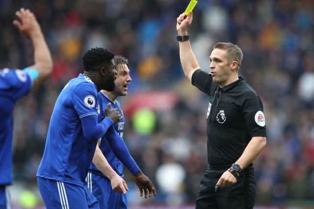 Referee Craig Pawson annoys Cardiff City players.