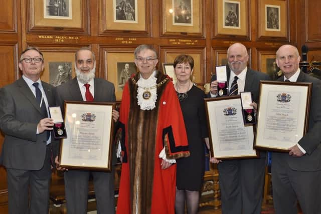 Mayor of Peterborough Cllr Chris Ash, Cllr Peter Hiller and Gillian Beasley with new Aldermen Nazim Khan, Keith Sharp and John Peach EMN-190104-075244009