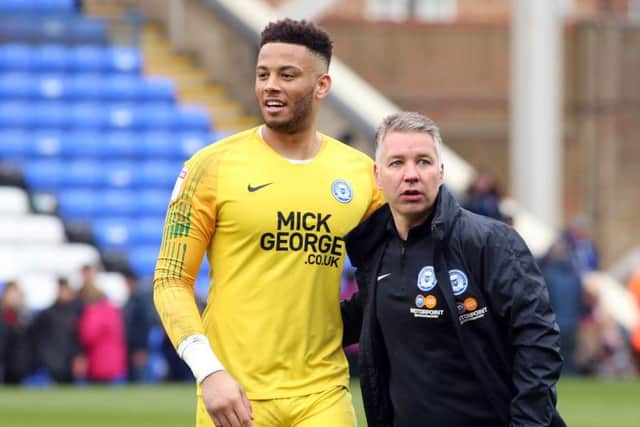 Posh manager Darren Ferguson with goalkeeper Aaron Chapman after the 2-0 win over Gillingham.  Photo: Joe Dent/theposh.com