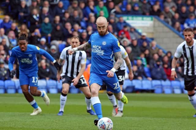 Marcus Maddison opens the scoring for Posh against Gillingham from the penalty spot. Photo: Joe Dent/theposh.com