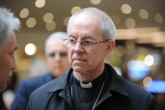 Archbishop of Canterbury Justin Welby visiting Peterborough with Bishop of Peterborough  Rt Revd. Donald Allister, The Vicar of Peterborough Revd Canon Ian Black and Harry Traynor, assistant centre manager , during a tour of Queensgate