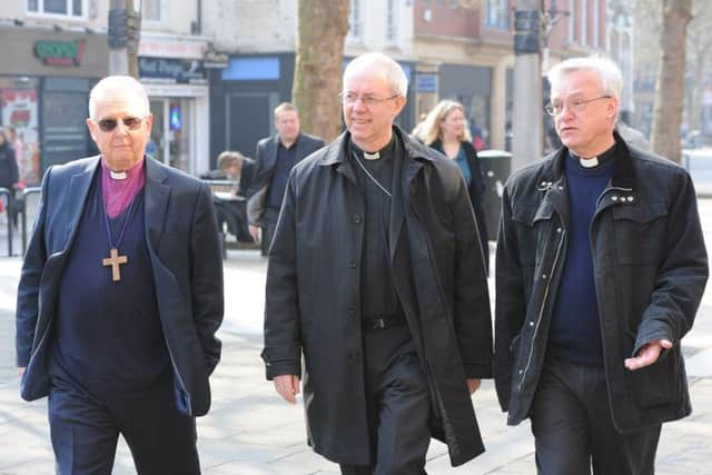 Archbishop of Canterbury Justin Welby visiting Peterborough with Bishop of Peterborough  Rt Revd. Donald Allister, The Vicar of Peterborough Revd Canon Ian Black and Harry Traynor, assistant centre manager , during a tour of Queensgate Queensgate EMN-190804-114837009