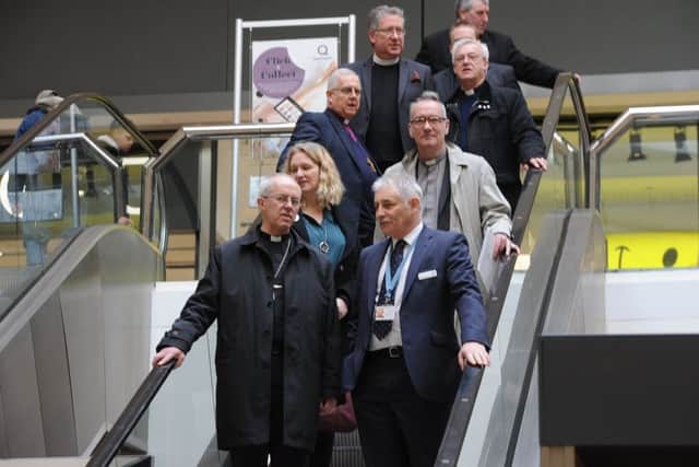 Archbishop of Canterbury Justin Welby visiting Peterborough with Bishop of Peterborough  Rt Revd. Donald Allister, The Vicar of Peterborough Revd Canon Ian Black and Harry Traynor, assistant centre manager , during a tour of Queensgate