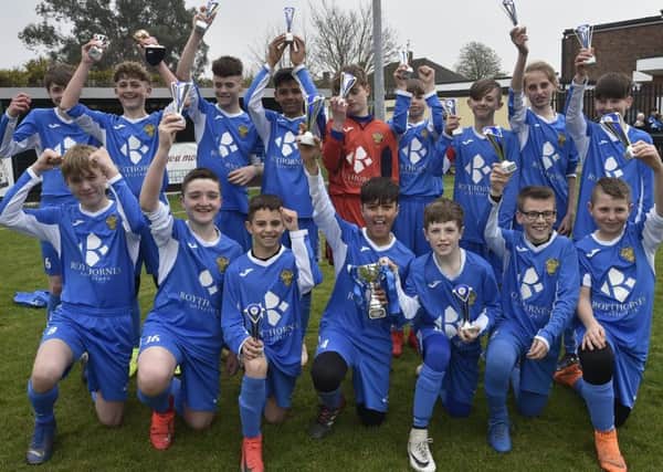 Spalding United Blue Under 13s celebrate their League Cup success.