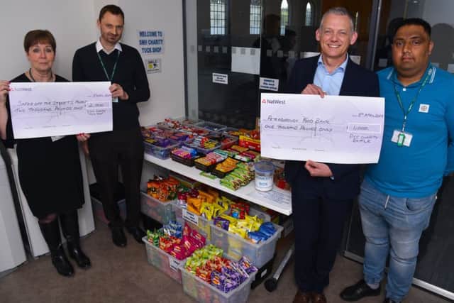 Cheques totalling £3,000 are being handed over to local good causes