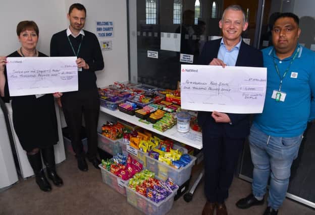 Cheques totalling £3,000 are being handed over to local good causes
