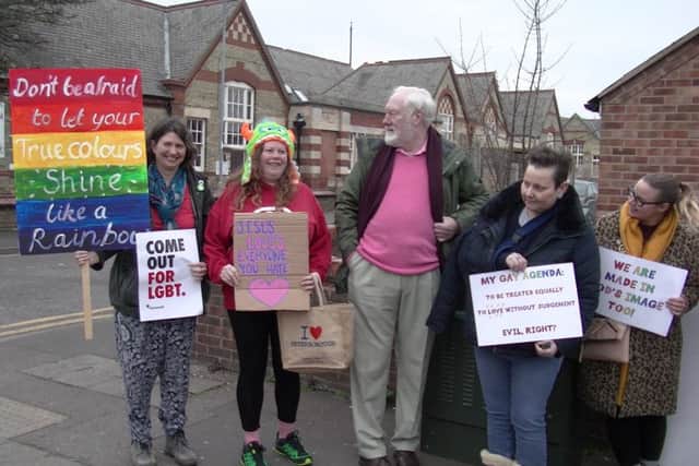 Protesters outside the church