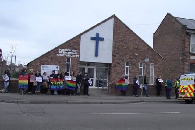 Protesters outside the church