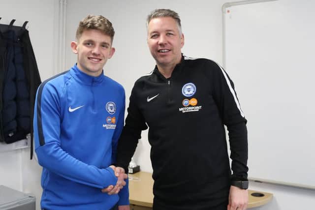 Kyle Barker with Posh manager Darren Ferguson. Photo: Joe Dent/theposh.com.