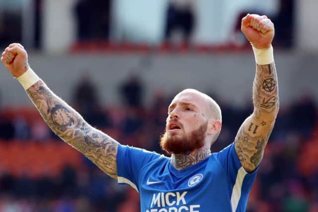 Marcus Maddison of Peterborough United celebrates the victory at Blackpool full-time. Photo: Joe Dent/theposh.com.