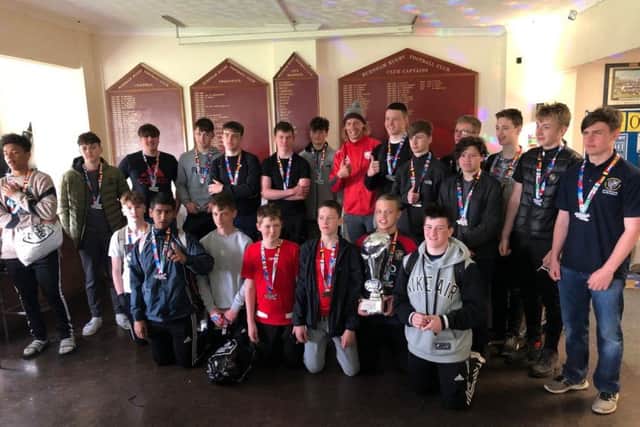 Borough Under 15s were presented with their trophy by 19-times capped England international Billy Twelvetrees (in red in the back row).